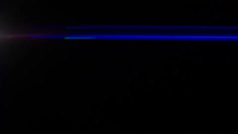 Anamorphic lens flare, bokeh light leaks, flash ray effect over black background Stockbeeldmateriaal 184293790