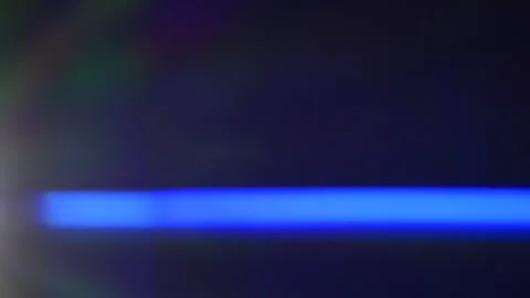 Anamorphic lens flare, bokeh light leaks, flash ray effect over black background Stock Footage 201838908