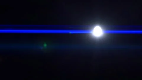 Anamorphic lens flare, bokeh light leaks, flash ray effect over black background Stock Footage 219301728