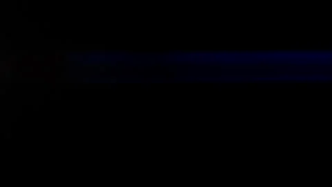 Anamorphic lens flare, bokeh light leaks, flash ray effect over black background Vídeo Stock 221213589