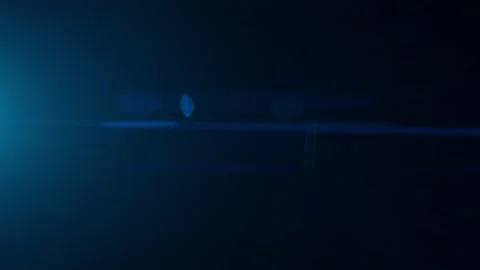Anamorphic Lens Flare. Horizontal shining in the dark Stock Footage 157599902