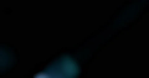 Anamorphic Lens flares on black background for easy overlay. Video stock 220633022