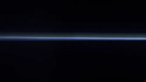 Anamorphic light moves on a dark background Vídeos de archivo 124593549