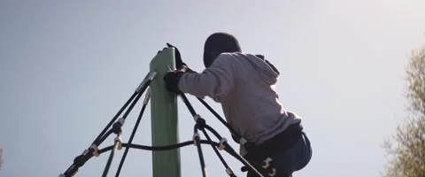 Anamorphic Little Black Boy On Top Of A Carousel Medium Low Angle Shot Stock Footage 201429705