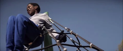 Anamorphic Little Black Children On Carousel Medium Low Angle Shot Stock Footage 201430095