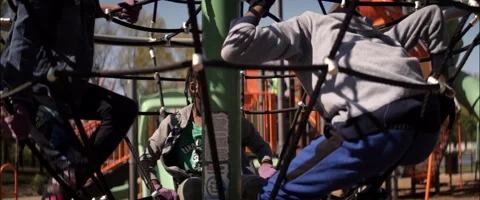 Anamorphic Little Black Children Inside Carousel On Playground Medium Front Shot Stock Footage 201429648