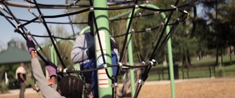 Anamorphic Little Black Children Playing Inside Carousel On Playground 2 Stock Footage 201429861