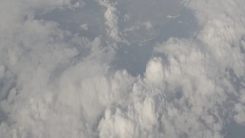 Anamorphic shot above clouds beautiful land earth planet clouds airplane view 3 Stock Footage 118882264