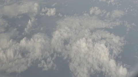Anamorphic shot above clouds land forest city clouds helicopter airplane view 1 Stock Footage 118859747
