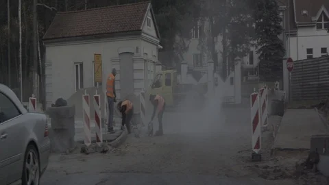 Anamorphic shot construction workers street road passing by driving shot Stock Footage 118857876