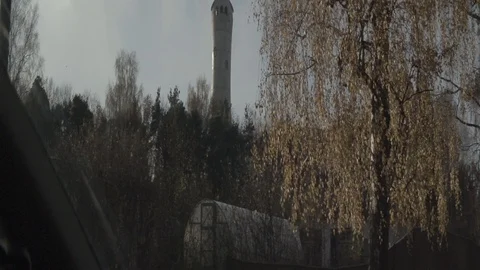 Anamorphic shot from inside car passing street private houses trees neighborhood Stock Footage 118857996