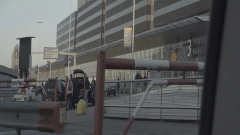 Anamorphic shot passing by shot entering parking area departure airport schiphol Stock Footage 118885201