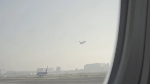 Anamorphic shot view from airplane window airplane aircraft departing 2 Stock Footage 118883808
