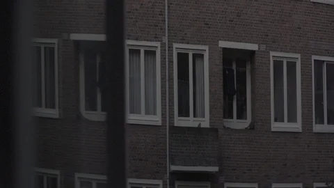 Anamorphic shot view from apartment window morning evening dutch city buildings Stock Footage 118886493