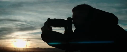 Anamorphic Silohuette Photographer Pull Focus On Camera Stock Footage 220783231