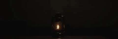 Anamorphic video of kerosene lamp light or an ancient lantern flickers in the Stock Footage 264767626