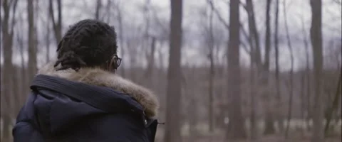 Anamorphic Young Black Girl Looking Into Forest Medium Angle Rear Shot Stock Footage 201266809
