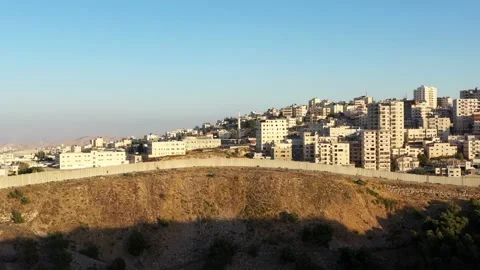 Anata Refugees Camp with security wall Near Pisgat zeev, Israel, Aerial Stock Footage 135469570
