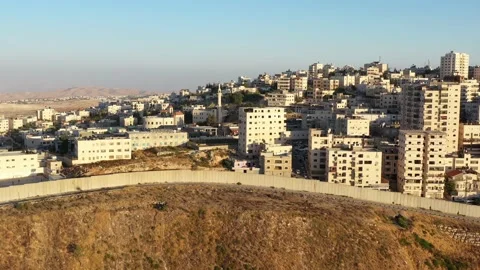Anata Refugees Camp with security wall Near Pisgat zeev, Israel, Aerial Stock Footage 135469721