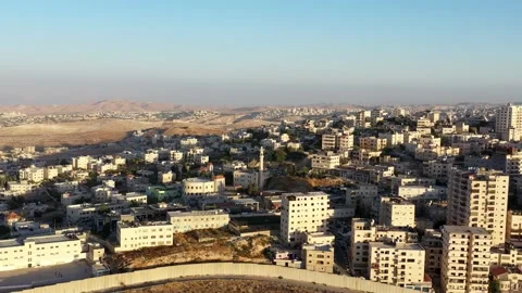 Anata Refugees Camp with security wall Near Pisgat zeev, Israel, Aerial Stock Footage 135469727