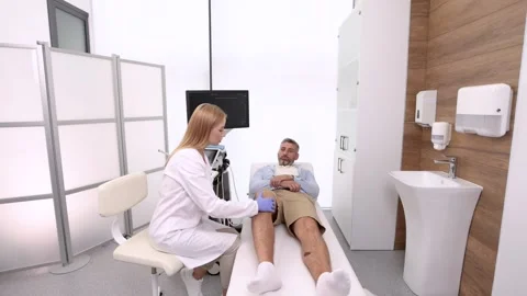 Anatomical model of knee bones on background of process of diagnostics of inj Stock Footage 317600251