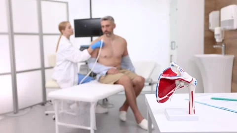 Anatomical model of shoulder structure against background of ultrasound exami Stock Footage 319929646