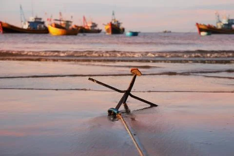 An anchor on the beach Фото