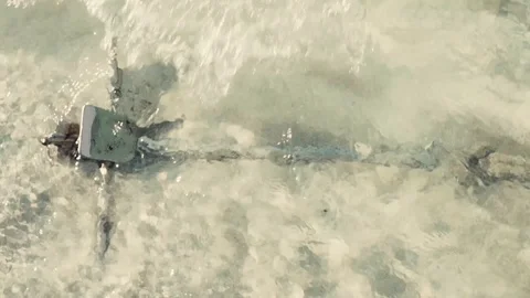 Anchor in the beach with waves on the background Stock Footage 99132327