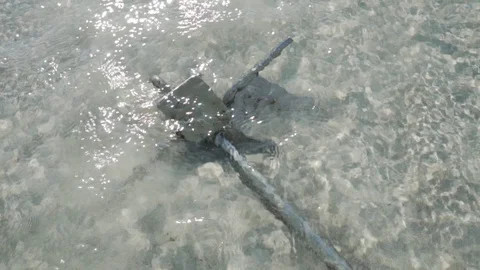 Anchor in the beach with waves on the background Stock Footage 103253293