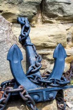 Anchor chained in rock Stock Photos