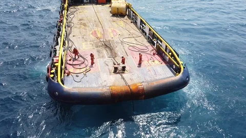 Anchor handling vessel pulling an anchor and wire Stock Footage 102639559