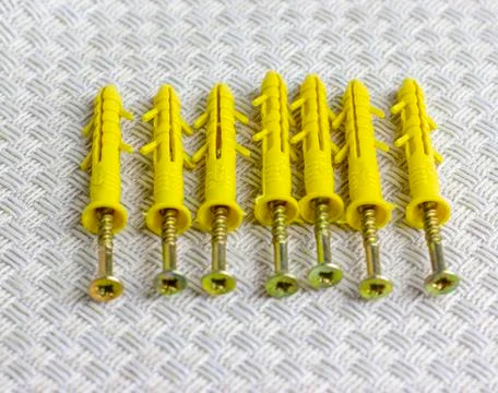 Anchor for mounting wall objects. Screws for housing repairs. Stockfoto's