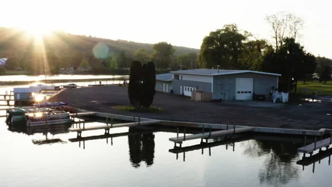 Anchored Boats By Dock at Sunset Stock Footage 196007159