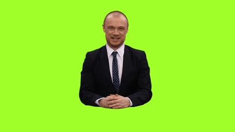 An anchorman sitting in a studio and talking on green screen background, Full HD Stock Footage 71758167