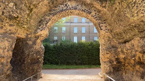 Ancient Abbey Arch Framing Modern Offices | Old Ruins vs New UK City Static Shot Stock Footage 308180952