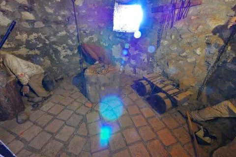 Ancient adaptations of a deck with ropes in a small stone room Stock Photos