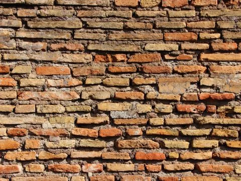 Ancient Aged Tile Brick Wall in Warm Colors Foto stock