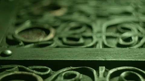 Ancient alien figurine resting inside ornate metal casket with intricate ca.. Stock Footage 337441332