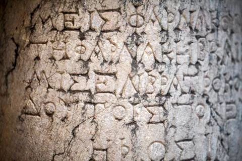 Ancient Alphabets on Marble Background Texture Stock Photos