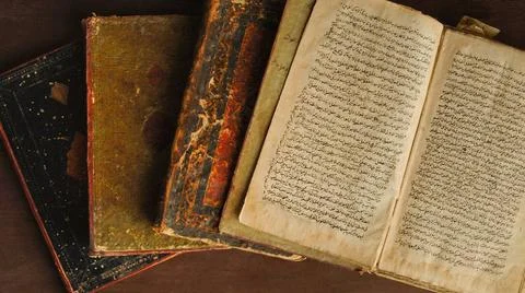 Ancient arabic book Stack of open ancient books in Arabic. Old Arabic manu... 写真素材