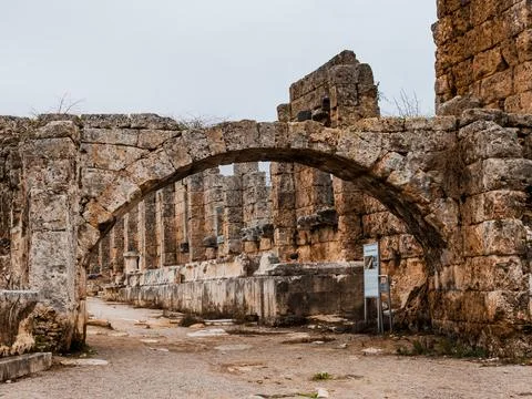 Ancient arch made of antique bricks in the excavated city of Turkey. Stock Photos