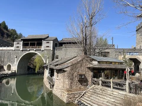 Ancient Arch Stone Bridge And Waterfront Architecture In Gubei Water Town Stock Photos