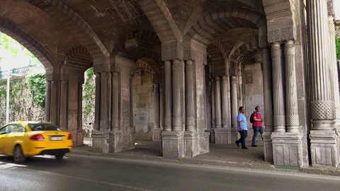 An ancient arch under the bridge for driving cars. Istanbul. Turkey. 4K. Video stock 82673191