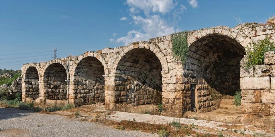 Ancient arched stone outer wall of the Stadium in the archaeological site of Stock Photos