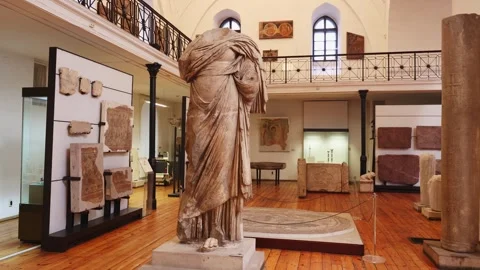 Ancient architectural elements and headless marble statue of Fortuna, Roman Stock Footage 317527673