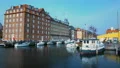 Ancient architecture with waving flag in Copenhagen harbor, Scandinavian tourism HD Footage
