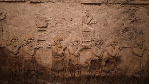 Ancient Assyrian Wall Panel Relief Depicting the Removal of Enemy Gods Stock Footage 246937311