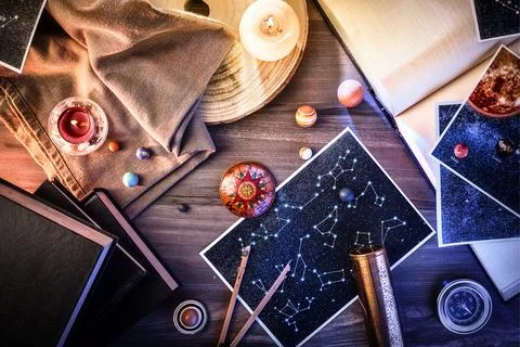 Ancient astrology study with retro objects on wooden table decorated Stock Photos
