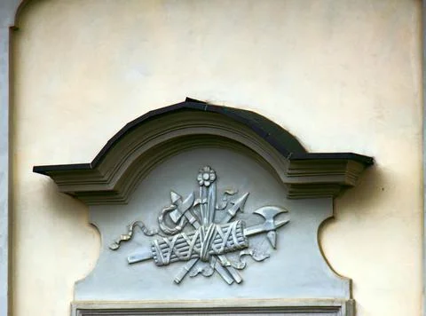 Ancient bas-reliefs on the Windows and walls of historical buildings Stock Photos