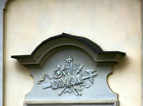Ancient bas-reliefs on the Windows and walls of historical buildings Ancie... Stock Photos